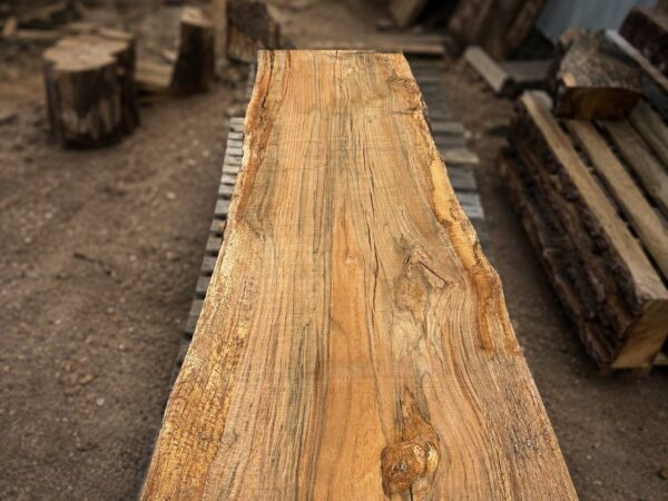 Air-dried live edge oak slab with thick rustic grain texture and natural live edges — solid hardwood slab for custom furniture and woodworking projects