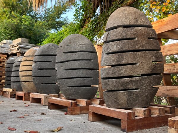 River stone garden lanterns in assorted shapes, colors, and sizes